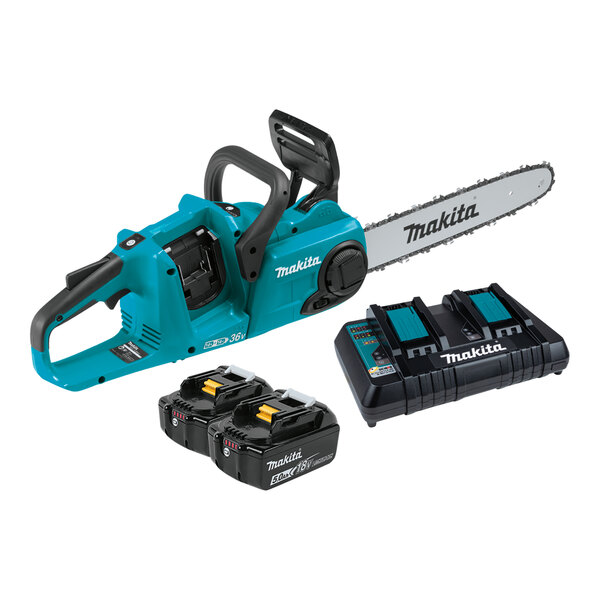 A close-up of a blue and black Makita chainsaw with black batteries and a black and blue dual port charger.
