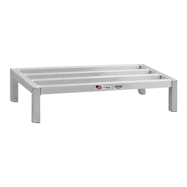 A white metal New Age dunnage rack with two shelves on legs.