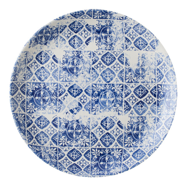 A white Dudson Maker's Porto china coupe plate with a blue circular pattern.