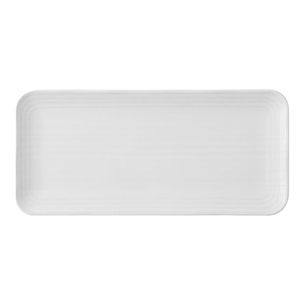 A white rectangular plate with a thin design.