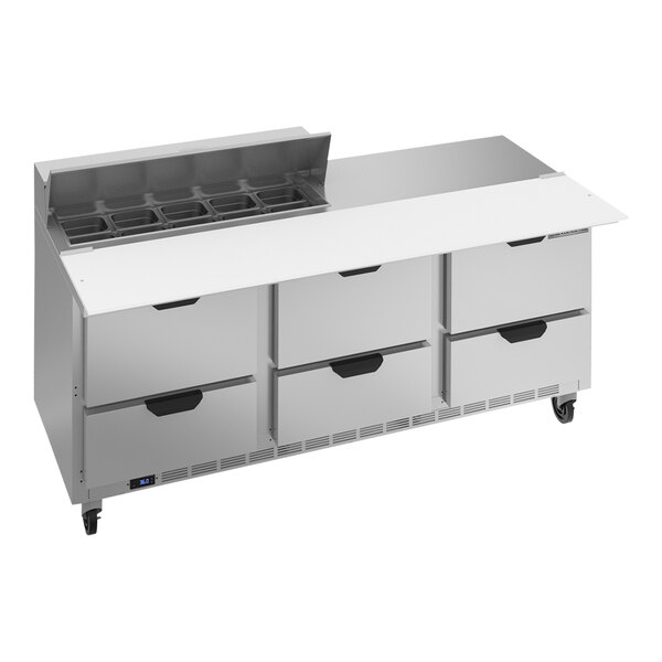 A Beverage-Air refrigerated sandwich prep table with 6 drawers and a cutting board on a stainless steel counter.