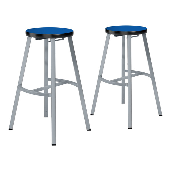A pair of National Public Seating Titan lab stools with Persian Blue seats and metal legs.