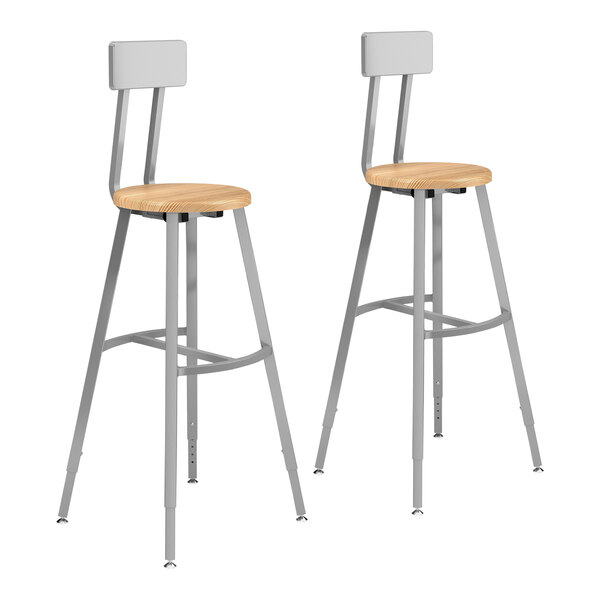 A pair of National Public Seating Titan lab stools with wooden seats.
