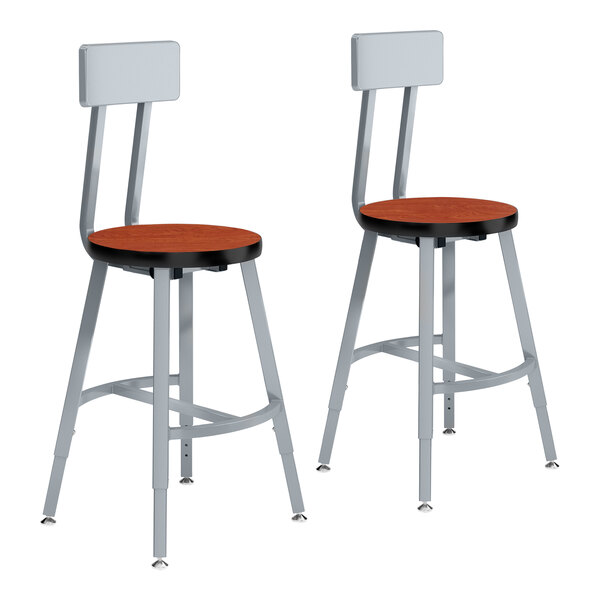 A pair of National Public Seating lab stools with Wild Cherry high-pressure laminate seat and backrests and gray steel frames.