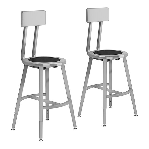 A pair of National Public Seating metal lab stools with black seats and backrests.
