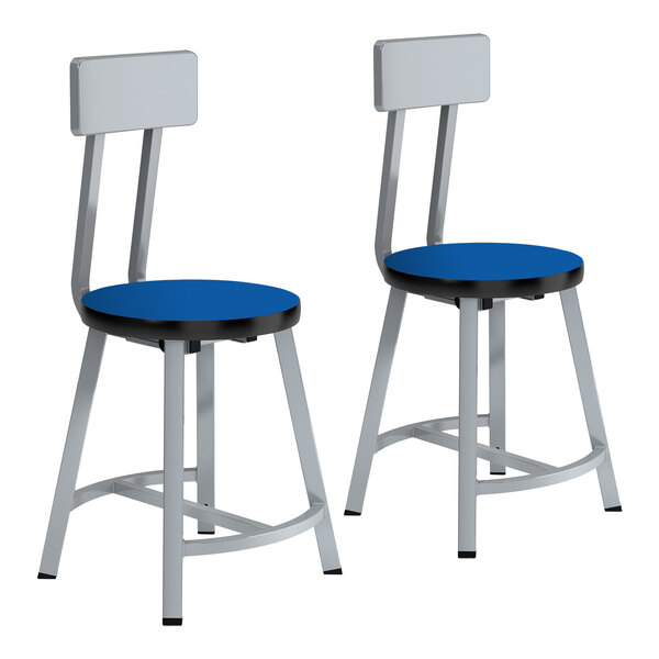 A pair of blue National Public Seating lab stools with metal legs and black seats.