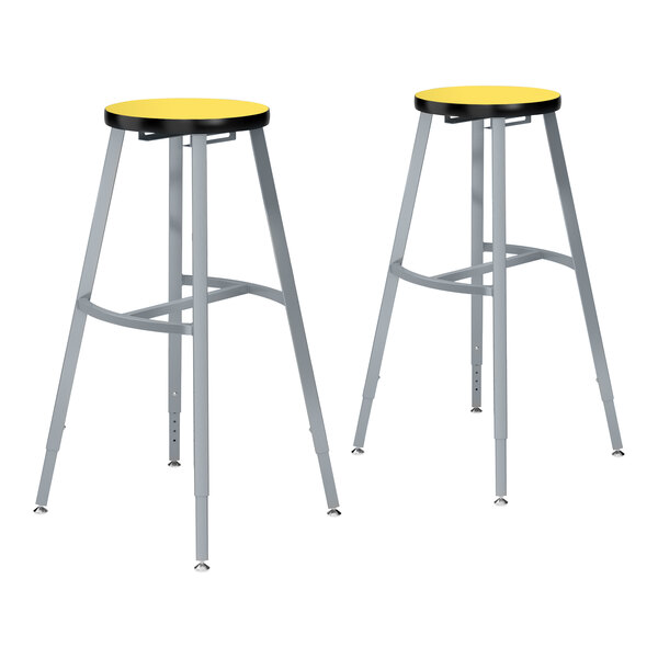 Two National Public Seating metal lab stools with Marigold high-pressure laminate seats.