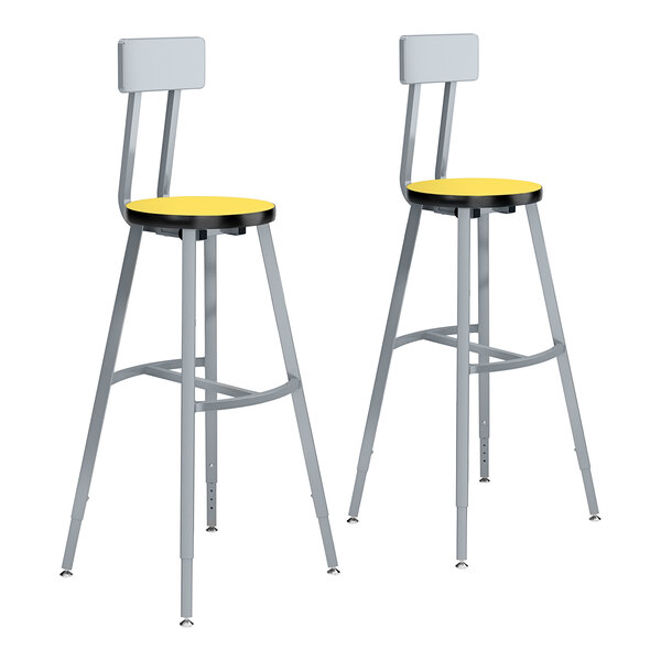 Two National Public Seating Titan lab stools with yellow and gray seats and backrests.