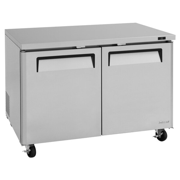 A stainless steel Turbo Air undercounter refrigerator with two doors.