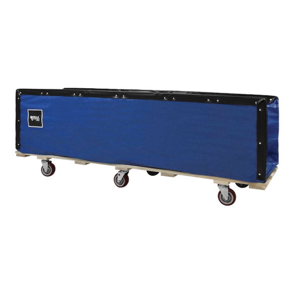 A blue and black tarp on wheels with a wooden pallet.