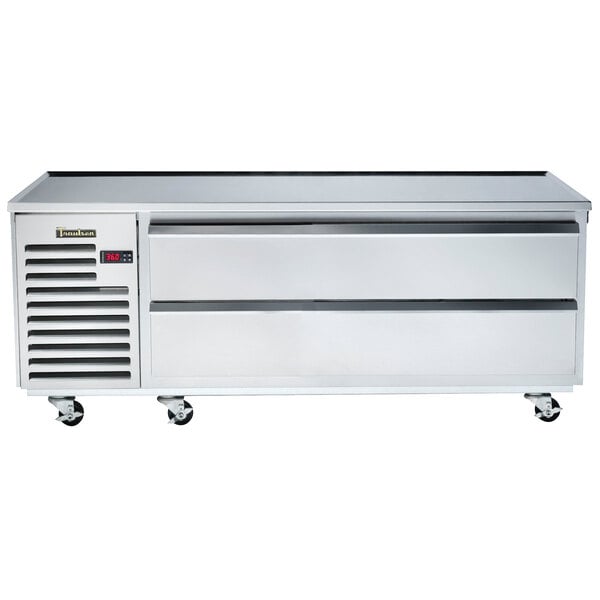 A Traulsen stainless steel refrigerated chef base with wheels.
