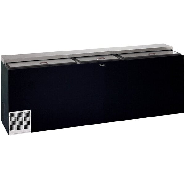 A black Perlick horizontal bottle cooler with a flat top and three glass doors.