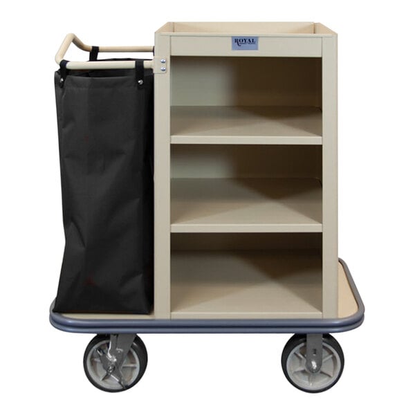 A Royal Basket Trucks beige housekeeping cart with a black bag on it.