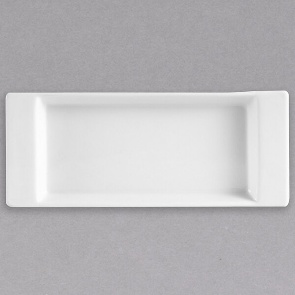 A white rectangular CAC porcelain tasting tray with small handles.