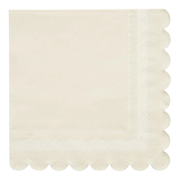 A white napkin with scalloped edges.
