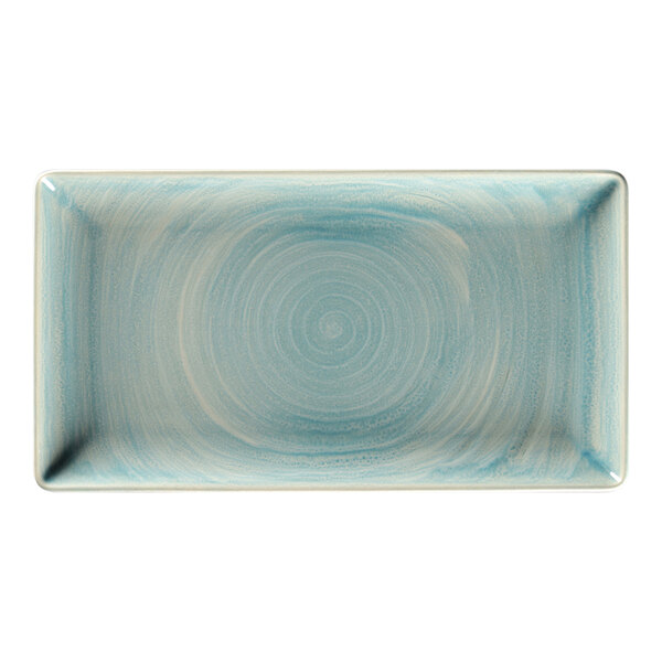 A close-up of a RAK Porcelain rectangular sapphire plate with a white swirl design.
