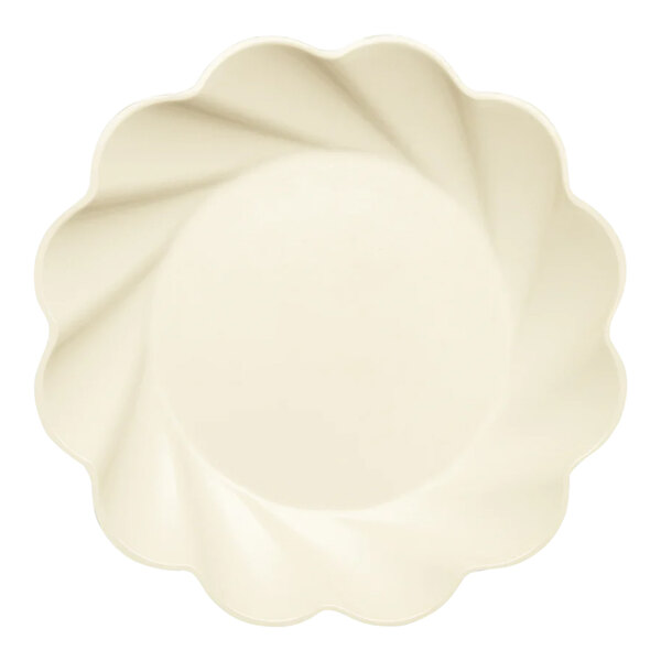 A white Sophistiplate Simply Eco dinner plate with a scalloped edge.