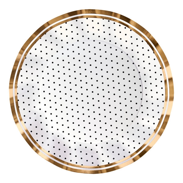 A Sophistiplate white paper dinner plate with black dots and gold trim.