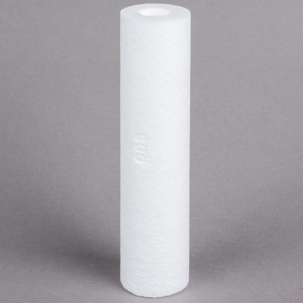A white cylinder with a small hole in it.