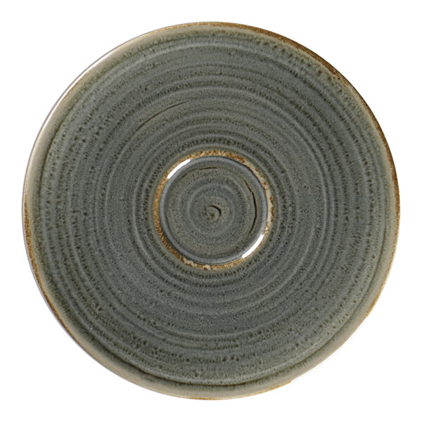 A peridot porcelain saucer with a circular design in the center.