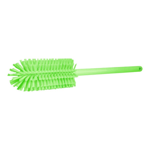 A green Carlisle Sparta bottle cleaning brush with long bristles.