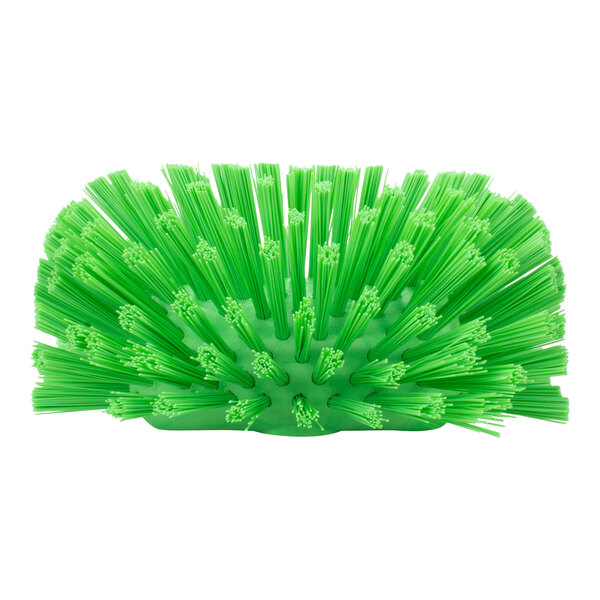 A Carlisle lime green plastic brush with polyester bristles.