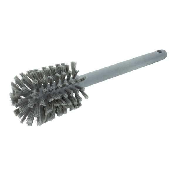 A close-up of a Carlisle grey cleaning brush with a handle.