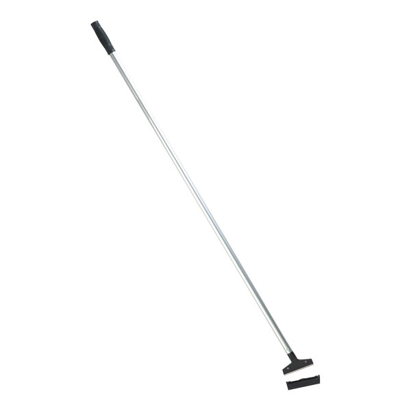 A Carlisle floor scraper with a long silver metal pole and a black handle.