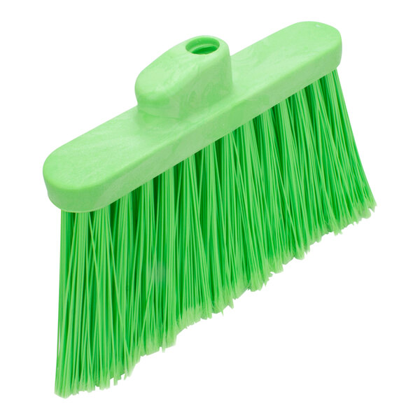 A close-up of a green Carlisle broom head with long bristles.