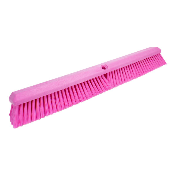 A pink Carlisle Sparta Omni Sweep broom head with bristles.