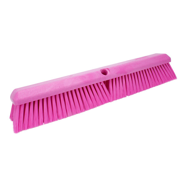A Carlisle pink commercial broom head with bristles.