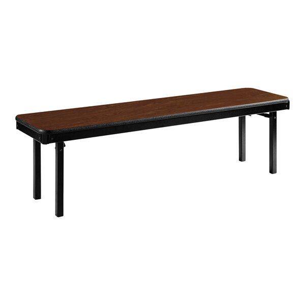 A National Public Seating Montana Walnut MDF folding bench with black legs.