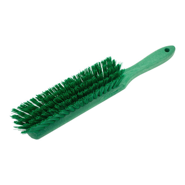 A Carlisle Sparta green counter brush with bristles.