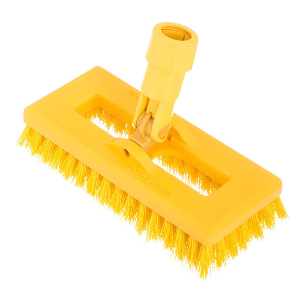 A yellow plastic Carlisle Sparta swivel scrub brush with a handle.