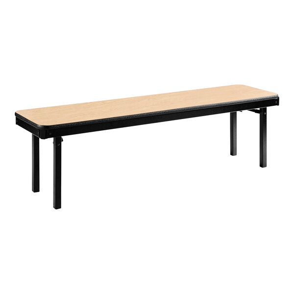 A National Public Seating Fusion Maple plywood folding bench with black legs.
