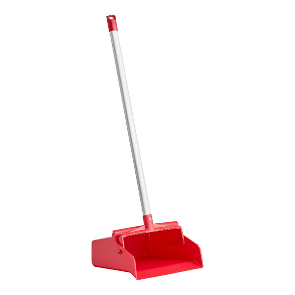 A red Carlisle upright dustpan with a long aluminum handle.