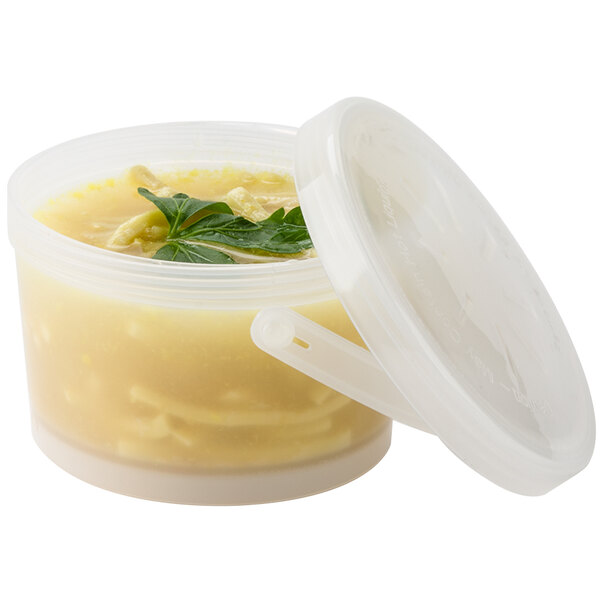 A clear plastic GET soup container with a lid and soup inside.