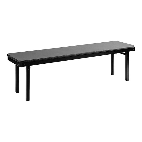 A black National Public Seating plywood folding bench with legs.