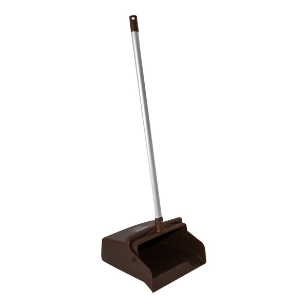 A brown dustpan with a long handle.