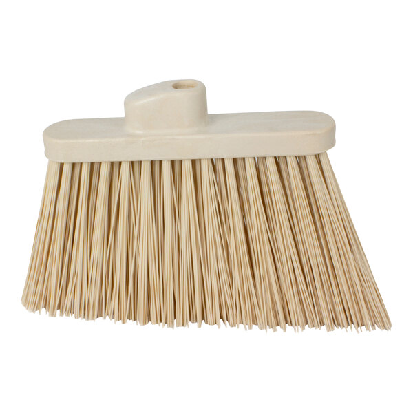 A close up of a Carlisle tan heavy-duty angled broom head with unflagged bristles.