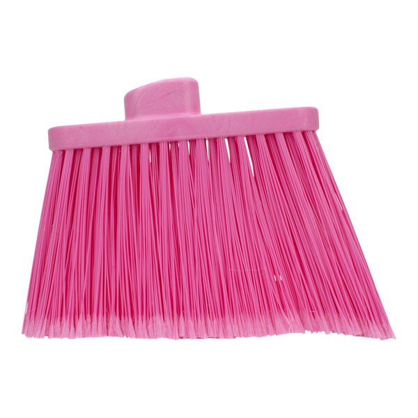 A pink Carlisle broom head with long bristles.