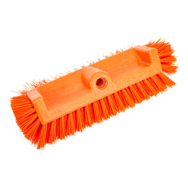 A close-up of a Carlisle orange floor scrub brush with end bristles.