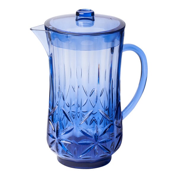 A Sophistiplate cobalt blue SAN plastic pitcher with a lid and a star pattern.