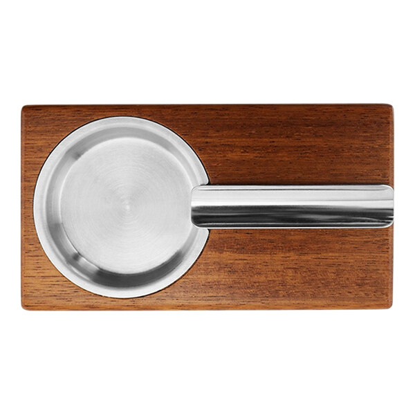A wooden ashtray with a silver metal bowl.