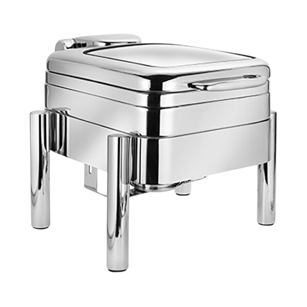 An Eastern Tabletop silver chafer with a glass lid on a stand.