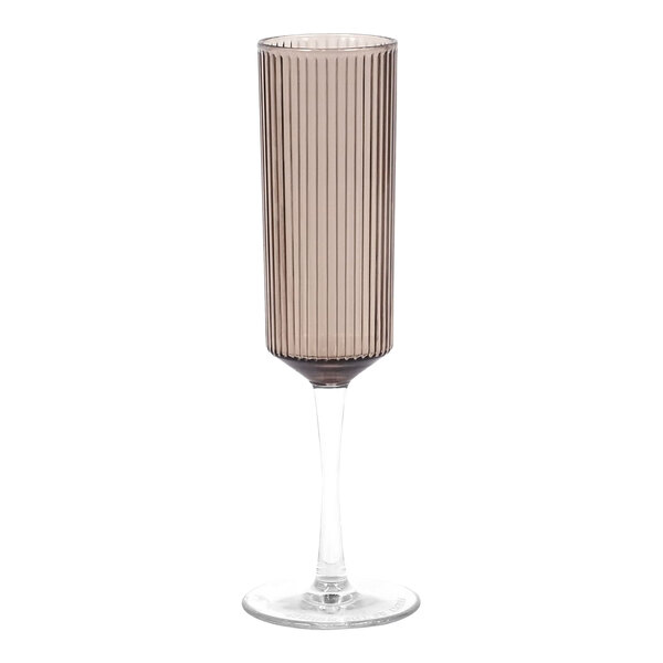 A Front of the House Gatsby smoke reusable champagne flute with a clear base and stripe pattern.