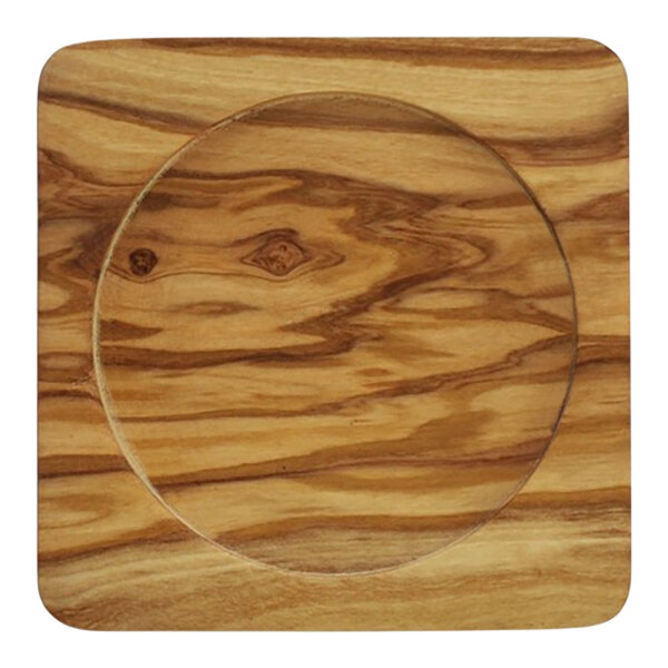 An olivewood wine coaster with a circular design in the middle.