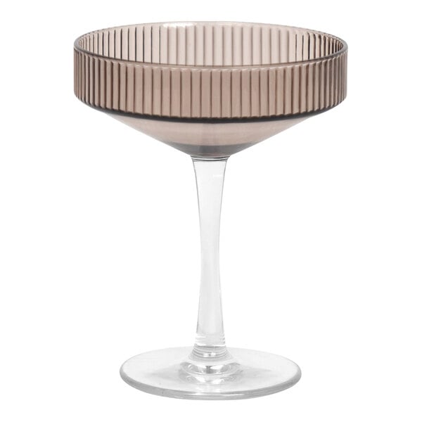 A clear plastic martini glass with a brown striped rim.