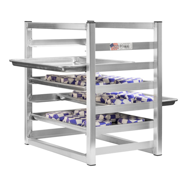 A New Age metal rack with trays of food on it.