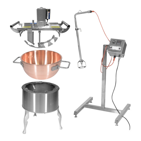 A Savage Bros natural gas candy stove kit with a large copper pot and a mixer on a stand.